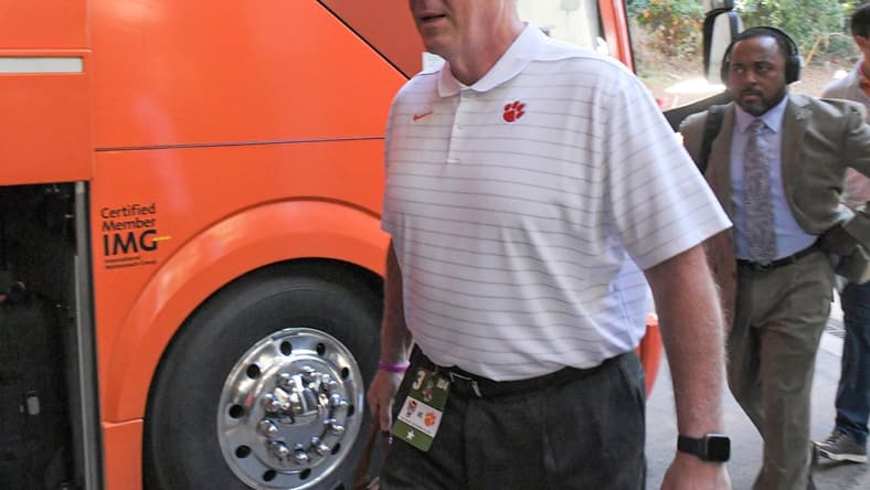 Clemson University Athletic Director Dan Radakovich gets off the bus before the game with NC State University at Carter-Finley Stadium in Raleigh, N.C., September 25, 2021.

Ncaa Football Clemson At Nc State