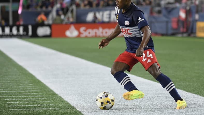 Sep 25, 2021; Foxborough, Massachusetts, USA; New England Revolution forward DeJuan Jones (24) controls the ball against Orlando City during the second half at Gillette Stadium. Mandatory Credit: Bob DeChiara-USA TODAY Sports