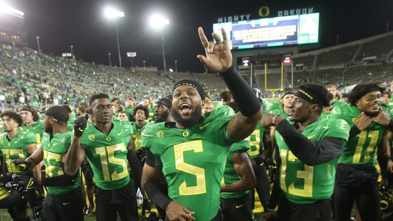 Oregon's Kayvon Thibodeaux celebrates with teammates after the win over Arizona in their first Pac-12 game of the season.Eug 0922521 Uo Az 16