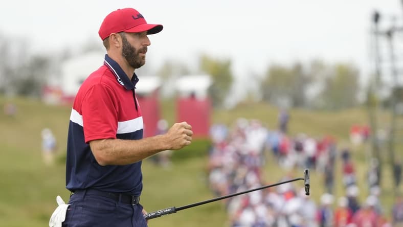 Sep 26, 2021; Haven, Wisconsin, USA; Team USA player Dustin Johnson reacts to his putt on the 15th green during day three singles rounds for the 43rd Ryder Cup golf competition at Whistling Straits. Mandatory Credit: Michael Madrid-USA TODAY Sports