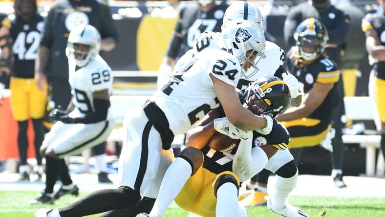 Sep 19, 2021; Pittsburgh, Pennsylvania, USA; Las Vegas Raiders safety Jonathan Abram tackles Pittsburgh Steelers wide receiver JuJu Smith-Schuster after a five yard gain in the first qwuarter at Heinz Field. Mandatory Credit: Philip G. Pavely-USA TODAY Sports