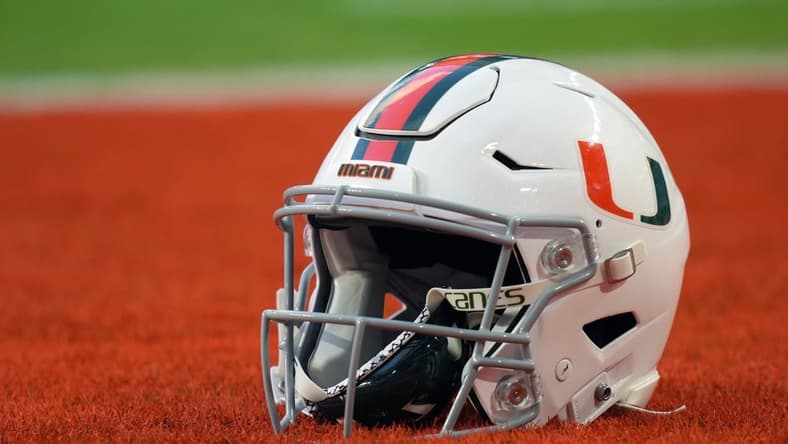 Sep 30, 2021; Miami Gardens, Florida, USA; A general view of a Miami Hurricanes helmet in the end zone prior to the game between the Miami Hurricanes and the Virginia Cavaliers at Hard Rock Stadium. Mandatory Credit: Jasen Vinlove-USA TODAY Sports