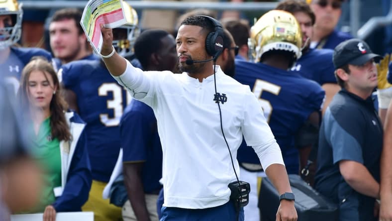 Oct 2, 2021; South Bend, Indiana, USA; Notre Dame Fighting Irish Defensive Coordinator Marcus Freeman signals to his players in the second quarter against the Cincinnati Bearcats at Notre Dame Stadium. Mandatory Credit: Matt Cashore-USA TODAY Sports