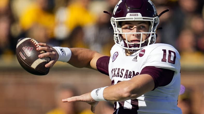 Oct 16, 2021; Columbia, Missouri, USA; Texas A&M Aggies quarterback Zach Calzada (10) throws a pass against the Missouri Tigers during the first half at Faurot Field at Memorial Stadium. Mandatory Credit: Jay Biggerstaff-USA TODAY Sports