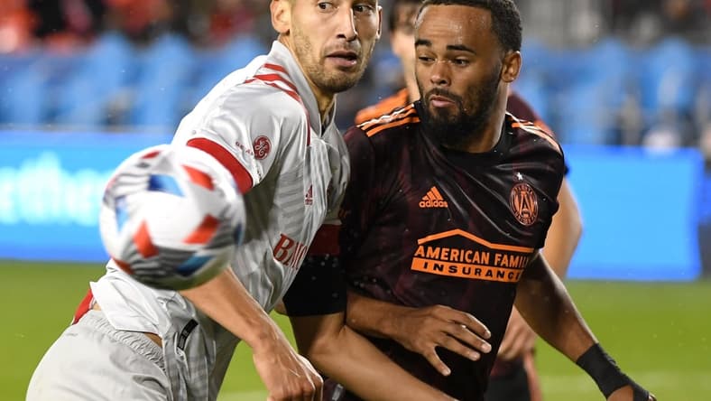 Oct 16, 2021; Toronto, Ontario, CAN;   Toronto FC defender Omar Gonzalez (44) watches his saved header bounce away from Atlanta United defender Anton Walkes (4) in the second half at BMO Field. Mandatory Credit: Dan Hamilton-USA TODAY Sports