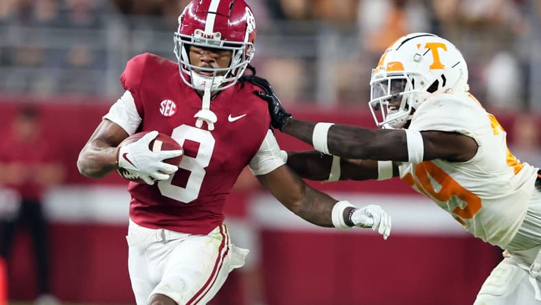 Oct 23, 2021; Tuscaloosa, Alabama, USA; Alabama Crimson Tide wide receiver John Metchie III (8) is pushed out of bounds by Tennessee Volunteers defensive back Brandon Turnage (29) during the first half at Bryant-Denny Stadium. Mandatory Credit: Butch Dill-USA TODAY Sports