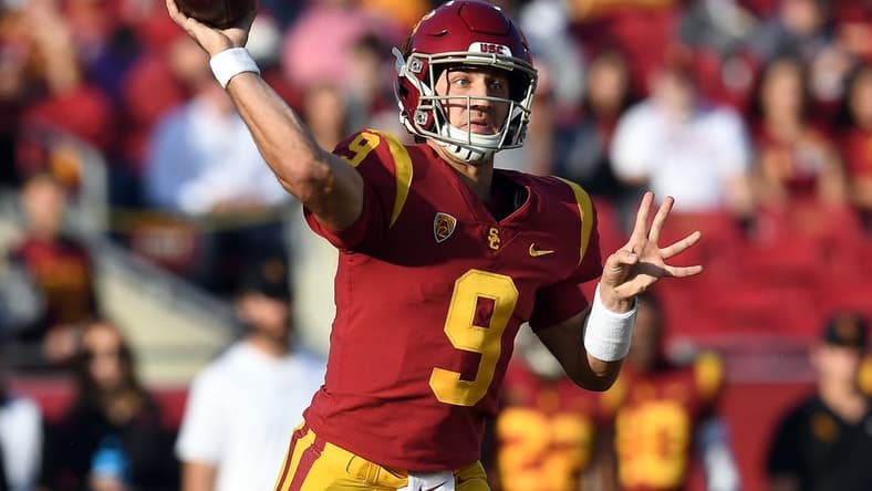 Oct 30, 2021; Los Angeles, California, USA; Southern California Trojans quarterback Kedon Slovis (9) throws against the Arizona Wildcats during the first half at United Airlines Field at Los Angeles Memorial Coliseum. Mandatory Credit: Gary A. Vasquez-USA TODAY Sports