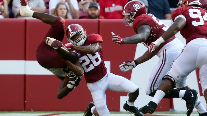Alabama defensive back Josh Jobe (28) upends a New Mexico State running back during the second half of Alabama's 62-10 victory over New Mexico State in Bryant-Denny Stadium Saturday, Sep. 7, 2019. [Staff Photo/Gary Cosby Jr.]

Alabama Vs New Mexico State