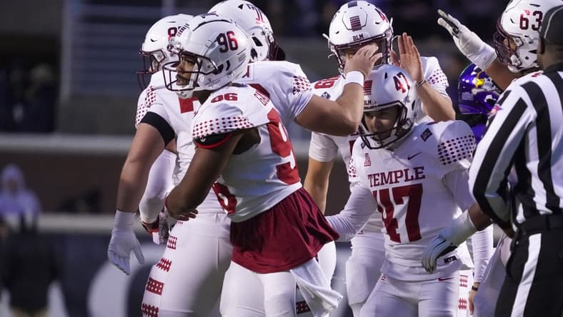 Nov 6, 2021; Greenville, North Carolina, USA;  Temple Owls place kicker Rory Bell (47) is congratulated by his teammates after his second half field goal against the East Carolina Pirates at Dowdy-Ficklen Stadium. Mandatory Credit: James Guillory-USA TODAY Sports