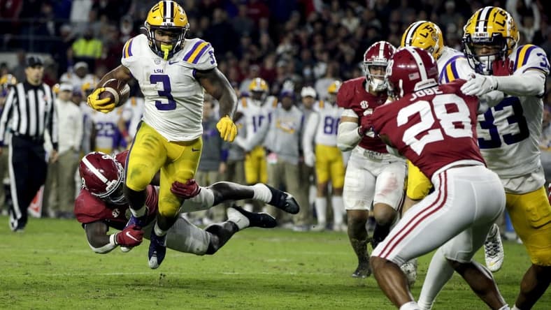 Nov 6, 2021; Tuscaloosa, Alabama, USA; LSU Tigers running back Tyrion Davis-Price (3) is tackled for a loss by Alabama Crimson Tide linebacker Christian Harris (8) during the second half at Bryant-Denny Stadium. Mandatory Credit: Butch Dill-USA TODAY Sports