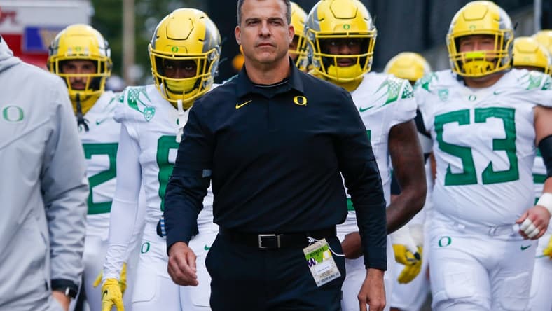 Nov 6, 2021; Seattle, Washington, USA; Oregon Ducks head coach Mario Cristobal walks with his players from the locker room before a game against the Washington Huskies at Alaska Airlines Field at Husky Stadium. Mandatory Credit: Joe Nicholson-USA TODAY Sports