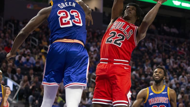 Nov 12, 2021; San Francisco, California, USA; Chicago Bulls forward Alize Johnson (22) shoots around Golden State Warriors forward Draymond Green (23) during the second quarter at Chase Center. Mandatory Credit: D. Ross Cameron-USA TODAY Sports