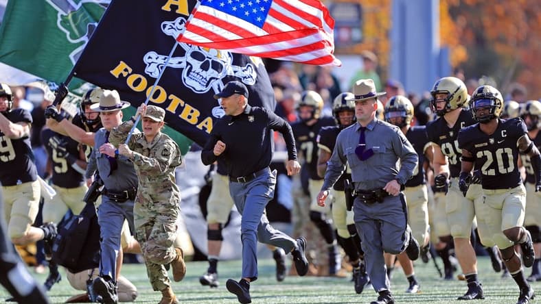 Nov 13, 2021; West Point, New York, USA; Army Black Knights head coach Jeff Monken leads his team out onto the field before a game against the Bucknell Bisons at Michie Stadium. Mandatory Credit: Danny Wild-USA TODAY Sports