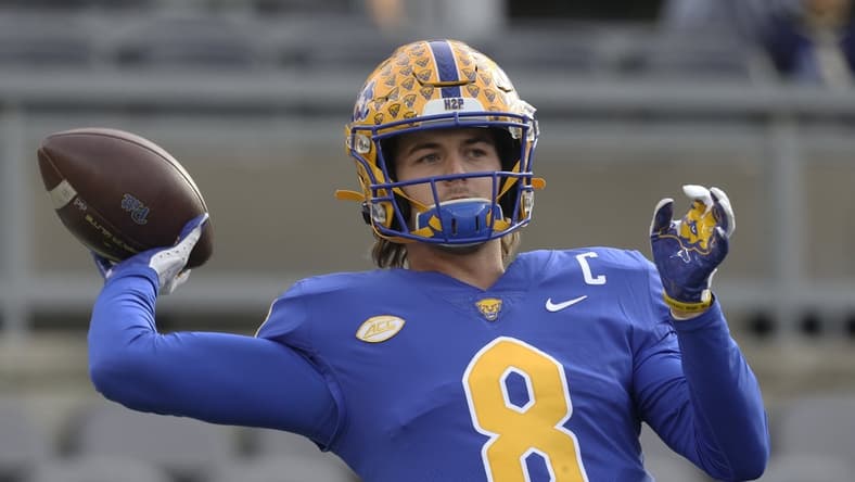 Nov 20, 2021; Pittsburgh, Pennsylvania, USA;  Pittsburgh Panthers quarterback Kenny Pickett (8) warms up before the game against the Virginia Cavaliers at Heinz Field. Mandatory Credit: Charles LeClaire-USA TODAY Sports