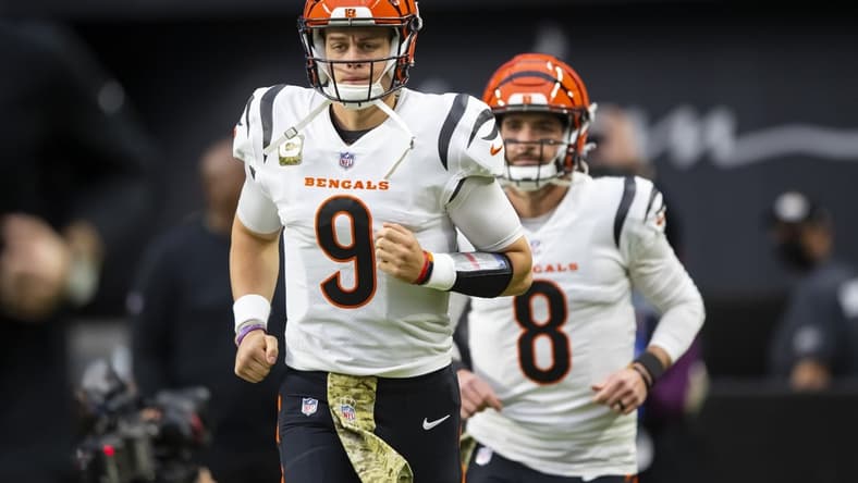 Nov 21, 2021; Paradise, Nevada, USA; Cincinnati Bengals quarterback Joe Burrow (9) and Brandon Allen (8) against the Las Vegas Raiders at Allegiant Stadium. Mandatory Credit: Mark J. Rebilas-USA TODAY Sports
