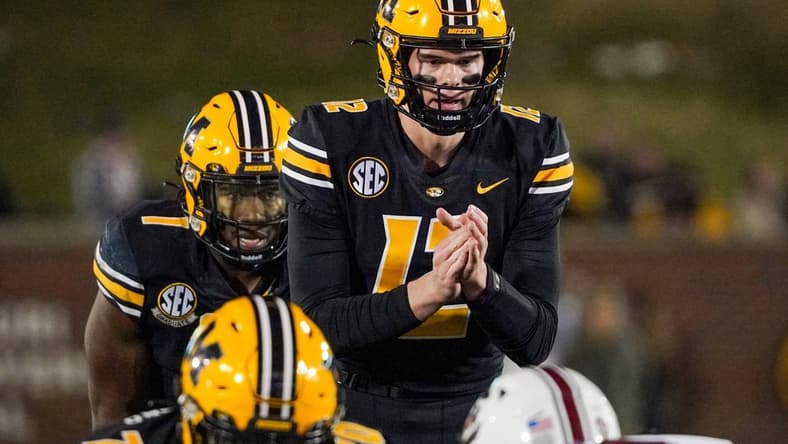 Nov 13, 2021; Columbia, Missouri, USA; Missouri Tigers quarterback Brady Cook (12) readies for the snap against the South Carolina Gamecocks during the game at Faurot Field at Memorial Stadium. Mandatory Credit: Denny Medley-USA TODAY Sports