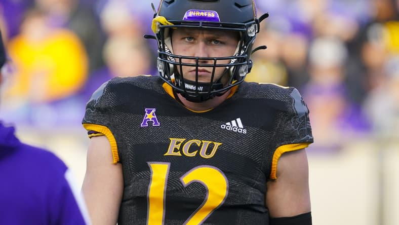 Nov 26, 2021; Greenville, North Carolina, USA;  East Carolina Pirates quarterback Holton Ahlers (12) looks on during the first half against the Cincinnati Bearcats at Dowdy-Ficklen Stadium. Mandatory Credit: James Guillory-USA TODAY Sports
