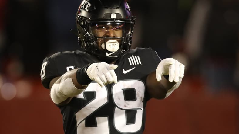 Nov 26, 2021; Ames, Iowa, USA; Iowa State Cyclones running back Breece Hall (28) celebrates after scoring a touchdown against the TCU Horned Frogs at Jack Trice Stadium. Mandatory Credit: Reese Strickland-USA TODAY Sports