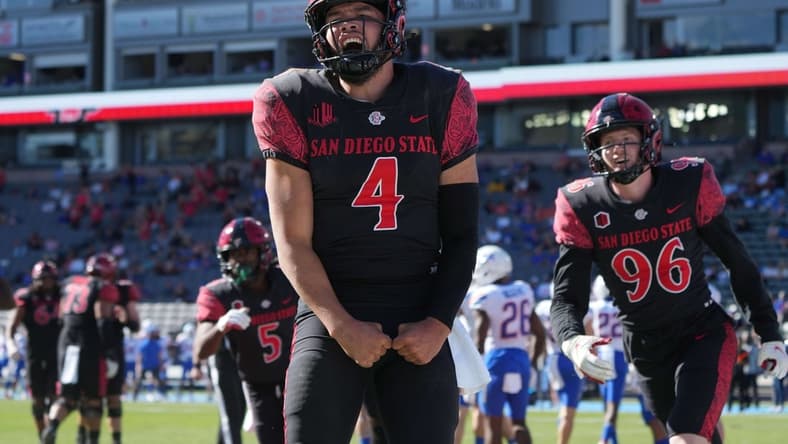 Nov 26, 2021; Carson, California, USA; San Diego State Aztecs quarterback Jordon Brookshire (4) celebrates after scoring a touchdown against the Boise State Broncos in the second half at Dignity Health Sports Park. San Diego State defeated Boise State 27-16. Mandatory Credit: Kirby Lee-USA TODAY Sports