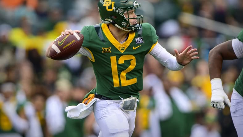 Nov 27, 2021; Waco, Texas, USA; Baylor Bears quarterback Blake Shapen (12) rolls out to pass against the Texas Tech Red Raiders during the first half at McLane Stadium. Mandatory Credit: Jerome Miron-USA TODAY Sports