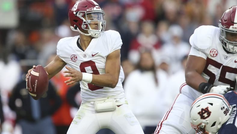 Nov 27, 2021; Auburn, Alabama, USA;  Alabama Crimson Tide quarterback Bryce Young (9) throws against the Auburn Tigers during the first half at Jordan-Hare Stadium. Mandatory Credit: Gary Cosby Jr.-USA TODAY Sports