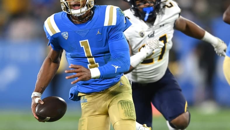 Nov 27, 2021; Pasadena, California, USA;    UCLA Bruins quarterback Dorian Thompson-Robinson (1) runs for 17 yards and a first down against the California Golden Bears in the second half at the Rose Bowl. Mandatory Credit: Jayne Kamin-Oncea-USA TODAY Sports