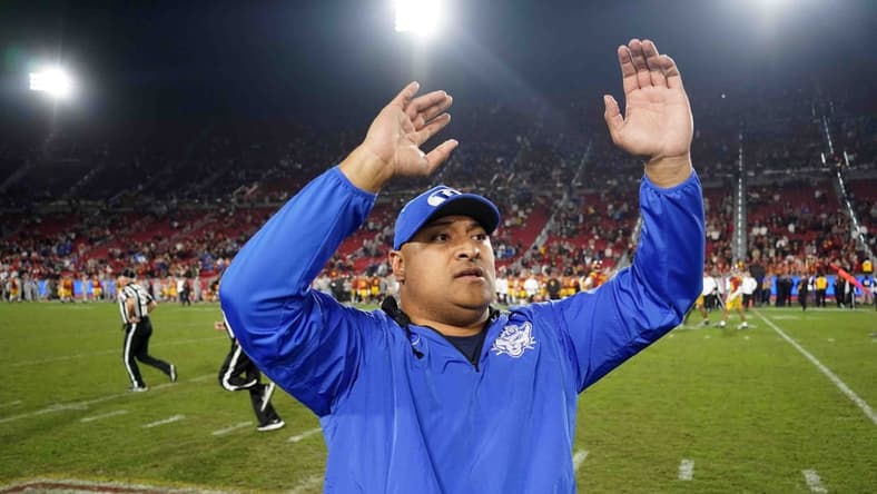 Nov 27, 2021; Los Angeles, California, USA; BYU Cougars head coach Kalani Sitake celebrates in the second half against the Southern California Trojans at United Airlines Field at Los Angeles Memorial Coliseum. Mandatory Credit: Kirby Lee-USA TODAY Sports