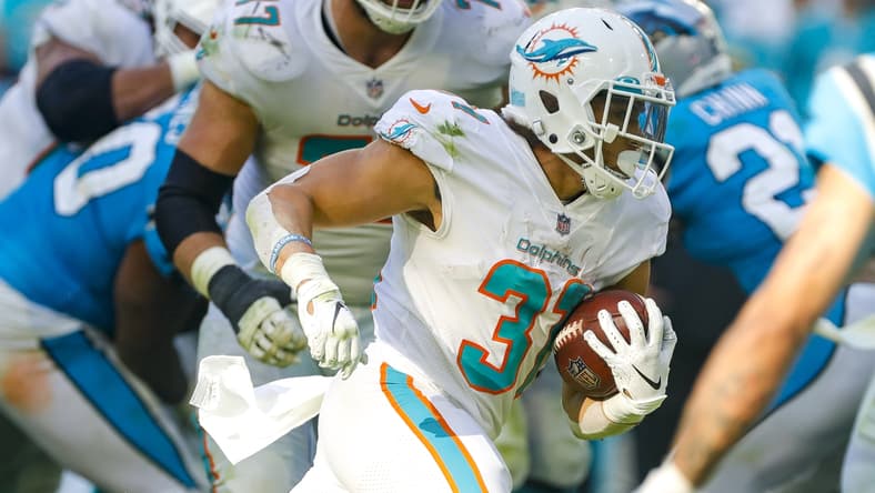 Nov 28, 2021; Miami Gardens, Florida, USA; Miami Dolphins running back Phillip Lindsay (31) runs with the football against the Carolina Panthers during the fourth quarter at Hard Rock Stadium. Mandatory Credit: Sam Navarro-USA TODAY Sports