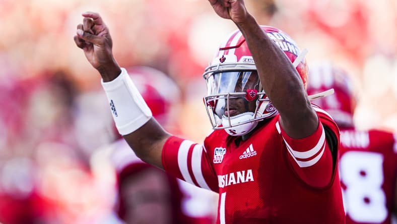 Dec 4, 2021; Lafayette, LA, USA; Louisiana Ragin Cajuns quarterback Levi Lewis (1) celebrates after scoring a touchdown during the second quarter against the Appalachian State Mountaineers during the Sun Belt Conference championship game. Mandatory Credit: Andrew Wevers-USA TODAY Sports