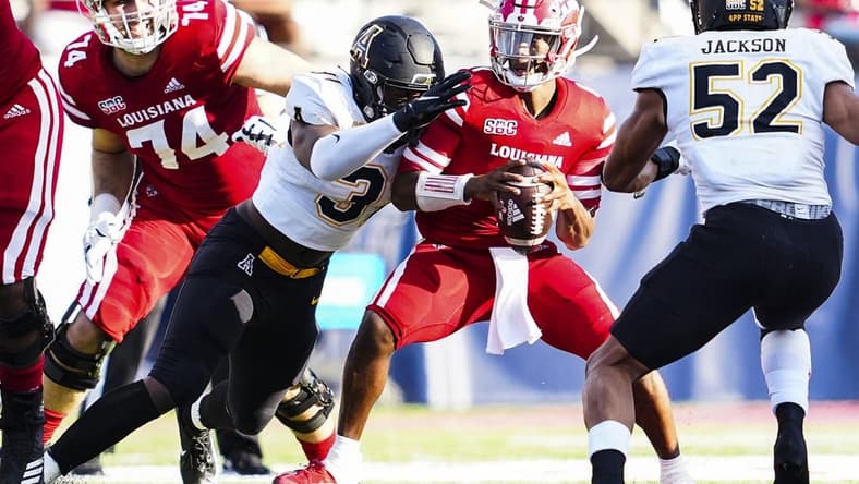 Dec 4, 2021; Lafayette, LA, USA; Appalachian State Mountaineers offensive linebacker Nick Hampton (31) sacks Louisiana Ragin' Cajuns quarterback Levi Lewis (1) during the first quarter of the Sun Belt Conference championship game. Mandatory Credit: Andrew Wevers-USA TODAY Sports