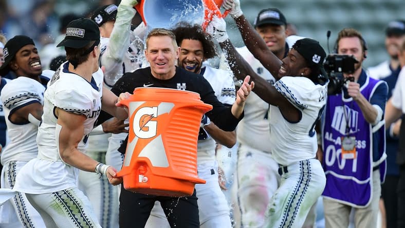 Dec 4, 2021; Carson, CA, USA; Utah State Aggies players pour gatorade on Utah State Aggies head coach Blake Anderson in celebration of the victory against San Diego State Aztecs in the Mountain West Conference championship game at Dignity Health Sports Park. Mandatory Credit: Gary A. Vasquez-USA TODAY Sports