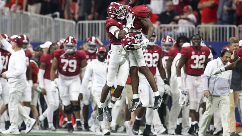 Dec 4, 2021; Atlanta, GA, USA; Alabama Crimson Tide defensive back Jordan Battle (9) celebrates with tight end Jahleel Billingsley (19) after an interception return for a touchdown against the Georgia Bulldogs in the second half during the SEC championship game at Mercedes-Benz Stadium. Mandatory Credit: Brett Davis-USA TODAY Sports