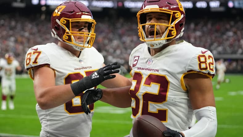 Dec 5, 2021; Paradise, Nevada, USA; Washington Football Team tight end Logan Thomas (82) celebrates with Washington Football Team tight end John Bates (87) after scoring a touchdown against the Las Vegas Raiders during the first quarter at Allegiant Stadium. Mandatory Credit: Stephen R. Sylvanie-USA TODAY Sports