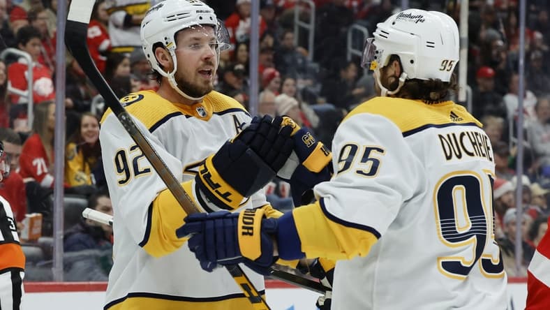 Dec 7, 2021; Detroit, Michigan, USA; Nashville Predators center Ryan Johansen (92) receives congratulations from center Matt Duchene (95) after scoring in the first period against the Detroit Red Wings in the first period at Little Caesars Arena. Mandatory Credit: Rick Osentoski-USA TODAY Sports