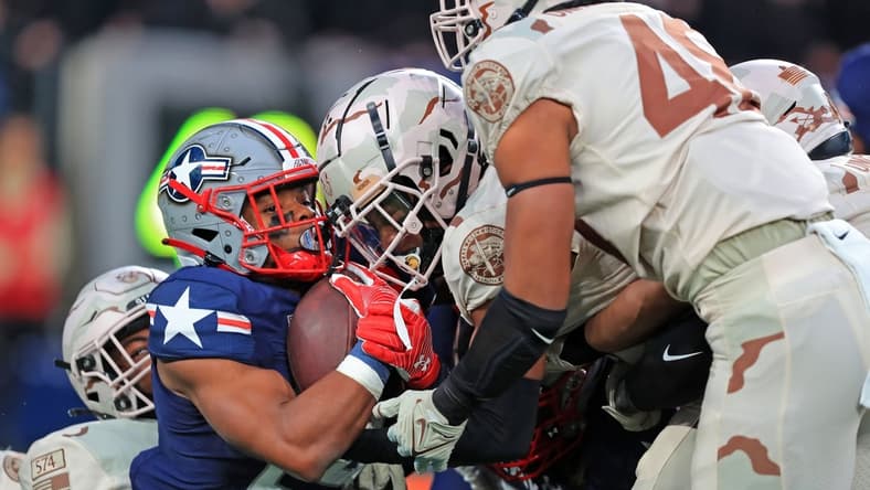 Dec 11, 2021; East Rutherford, New Jersey, USA; Navy Midshipmen running back Maquel Haywood (24) gets stuffed on a carry against the Army Black Knights during the second quarter of the 122nd Army-Navy game. Mandatory Credit: Danny Wild-USA TODAY Sports