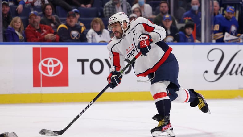 Dec 11, 2021; Buffalo, New York, USA;  Washington Capitals left wing Alex Ovechkin (8) takes a shot on goal during the third period against the Buffalo Sabres at KeyBank Center. Mandatory Credit: Timothy T. Ludwig-USA TODAY Sports