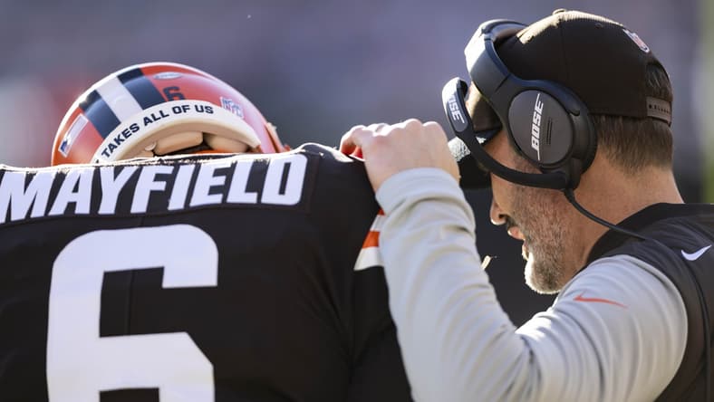 Dec 12, 2021; Cleveland, Ohio, USA; Cleveland Browns head coach Kevin Stefanski talks with quarterback Baker Mayfield (6) during the first quarter against the Baltimore Ravens at FirstEnergy Stadium. Mandatory Credit: Scott Galvin-USA TODAY Sports