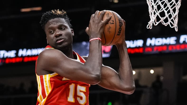Dec 13, 2021; Atlanta, Georgia, USA; Atlanta Hawks center Clint Capela (15) gets a rebound against the Houston Rockets during the first half at State Farm Arena. Mandatory Credit: Dale Zanine-USA TODAY Sports