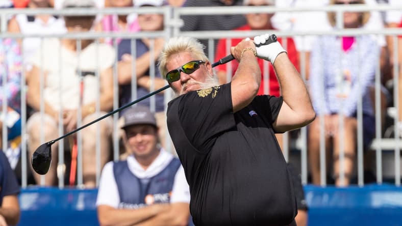 Dec 18, 2021; Orlando, Florida, USA; John Daly plays his shot off the first tee during the first round of the PNC Championship golf tournament at Grande Lakes Orlando Course. Mandatory Credit: Jeremy Reper-USA TODAY Sports