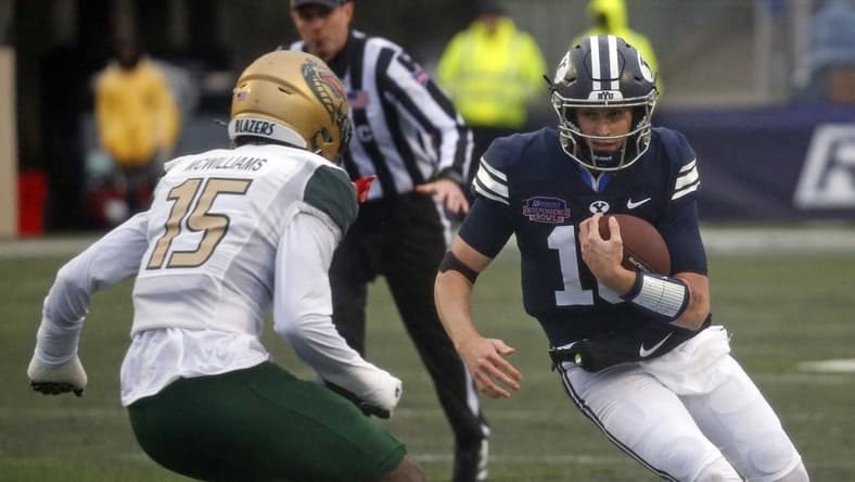 Dec 18, 2021; Shreveport, LA, USA; BYU Cougars quarterback Baylor Romney (16) runs the ball during the second quarter against the UAB Blazers during the 2021 Independence Bowl at Independence Stadium. Mandatory Credit: Petre Thomas-USA TODAY Sports