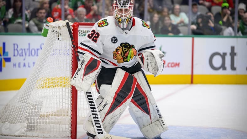 Dec 18, 2021; Dallas, Texas, USA; Chicago Blackhawks goaltender Kevin Lankinen (32) faces the Dallas Stars attack during the second period at the American Airlines Center. Mandatory Credit: Jerome Miron-USA TODAY Sports
