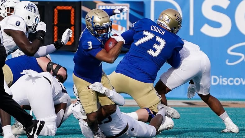 Dec 20, 2021; Conway, South Carolina, USA; Tulsa Golden Hurricane running back Shamari Brooks (3) is tackled by Old Dominion Monarchs safety Terry Jones during (13) in the 2021 Myrtle Beach Bowl at Brooks Stadium. Mandatory Credit: David Yeazell-USA TODAY Sports