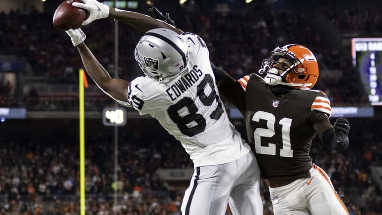 Dec 20, 2021; Cleveland, Ohio, USA; Las Vegas Raiders wide receiver Bryan Edwards (89) makes a touchdown reception in the end zone against Cleveland Browns cornerback Denzel Ward (21) during the first quarter at FirstEnergy Stadium. Mandatory Credit: Scott Galvin-USA TODAY Sports