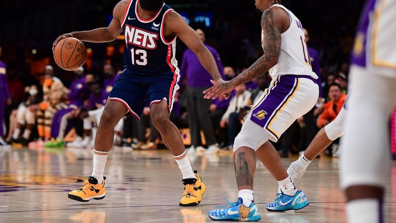 Dec 25, 2021; Los Angeles, California, USA; Brooklyn Nets guard James Harden (13) controls the ball against Los Angeles Lakers guard Malik Monk (11) during the first half at Crypto.com Arena. Mandatory Credit: Gary A. Vasquez-USA TODAY Sports