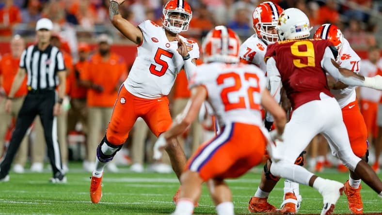 Dec 29, 2021; Orlando, Florida, USA;  Clemson Tigers quarterback D.J. Uiagalelei (5) drops back to pass in the first half against the Iowa State Cyclones at Camping World Stadium. Mandatory Credit: Nathan Ray Seebeck-USA TODAY Sports