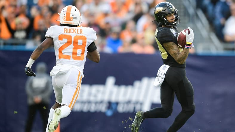 Purdue wide receiver Broc Thompson (29) catches a pass as Tennessee defensive back De'Shawn Rucker (28) defends at the 2021 Music City Bowl NCAA college football game at Nissan Stadium in Nashville, Tenn. on Thursday, Dec. 30, 2021.

Kns Tennessee Purdue