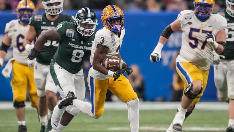 Dec 30, 2021; Atlanta, GA, USA; Pittsburgh Panthers wide receiver Jordan Addison (3) runs with the ball after a catch against the Michigan State Spartans during the first half during the 2021 Peach Bowl at Mercedes-Benz Stadium. Mandatory Credit: Dale Zanine-USA TODAY Sports