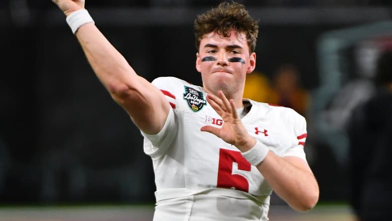 Dec 30, 2021; Paradise, Nevada, USA; Wisconsin Badgers quarterback Graham Mertz (5) warms up before facing the Arizona State Sun Devils in the 2021 Las Vegas Bowl at Allegiant Stadium. Mandatory Credit: Stephen R. Sylvanie-USA TODAY Sports