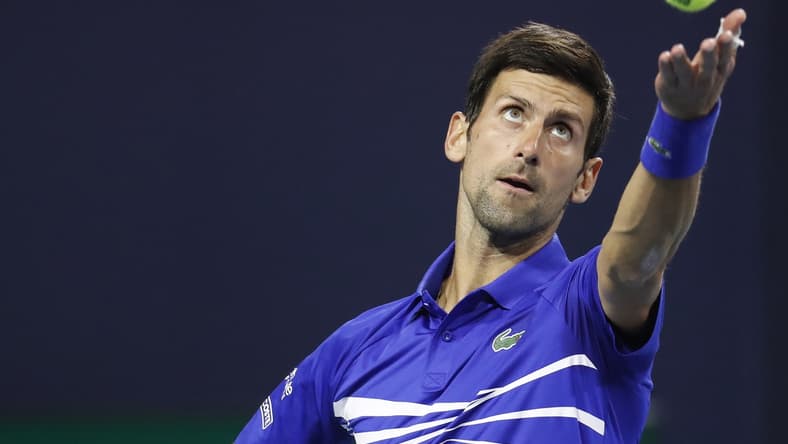 Mar 22, 2019; Miami Gardens, FL, USA; Novak Djokovic of Serbia serves against Bernard Tomic of Australia (not pictured) in the second round of the Miami Open at Miami Open Tennis Complex. Mandatory Credit: Geoff Burke-USA TODAY Sports