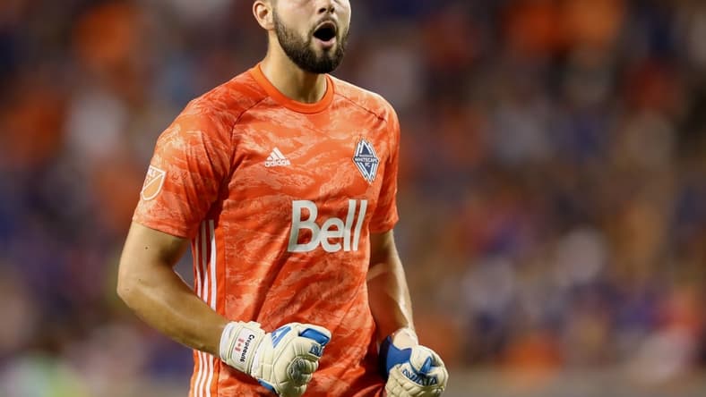 Aug 3, 2019; Cincinnati, OH, USA; Vancouver Whitecaps goalkeeper Maxime Crepeau (16) reacts to the goal scored by midfielder Felipe Martins (8) against FC Cincinnati in the second half at Nippert Stadium. Mandatory Credit: Aaron Doster-USA TODAY Sports
